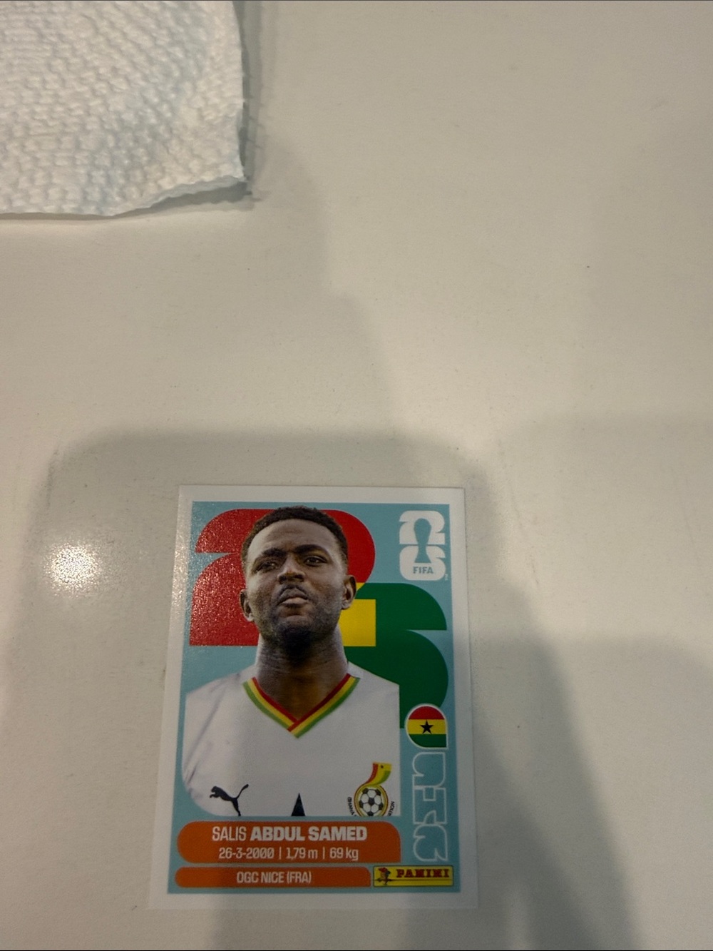 Panini Trading Card - White with Red Green Yellow Accents
